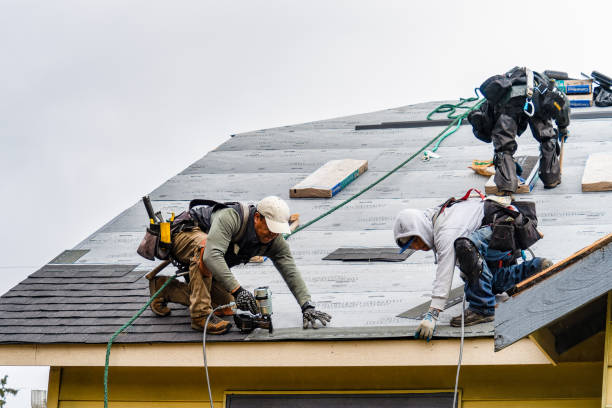 Professional Gutter Installation technician working in Marquette, MI